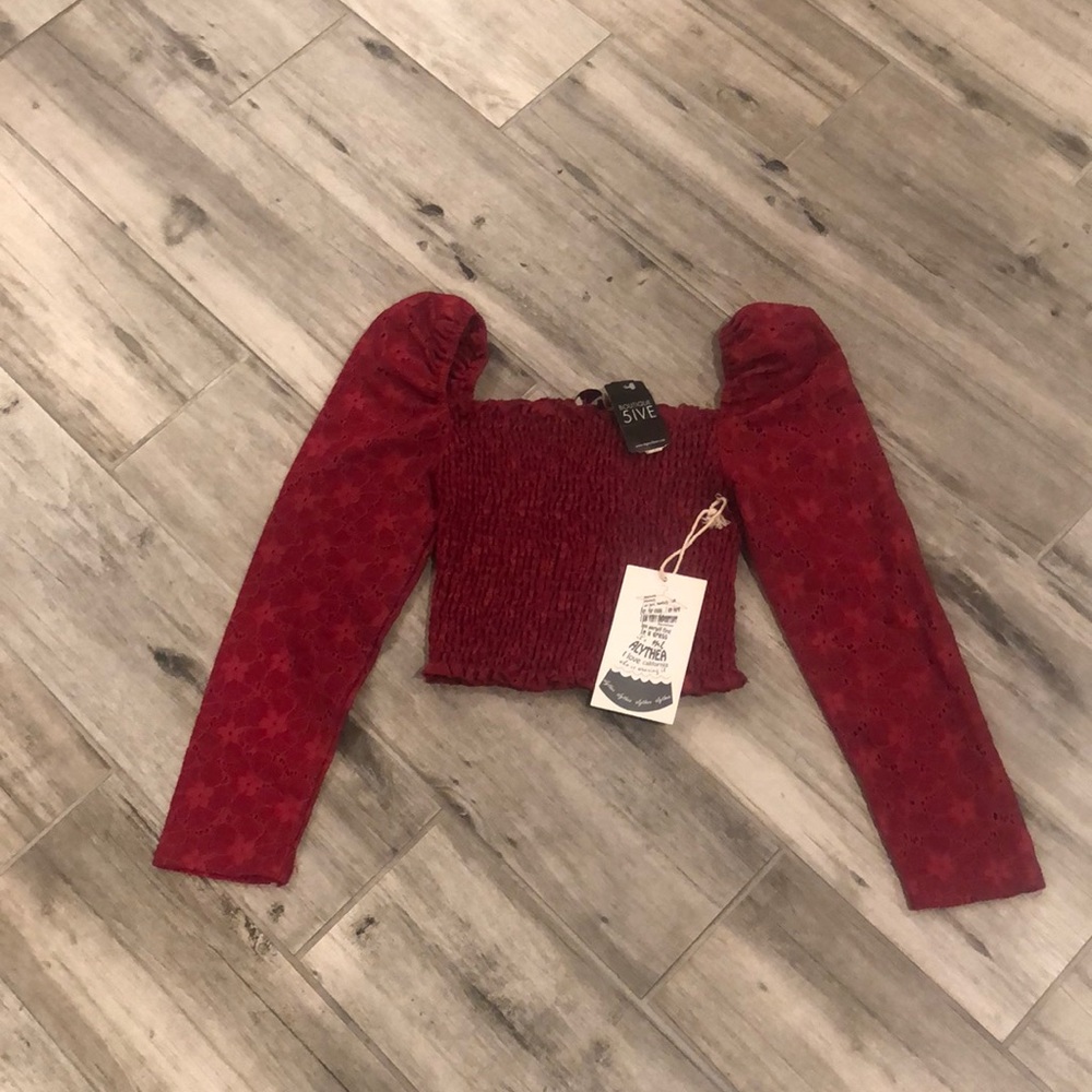 A cute off the shoulders red cropped shirt